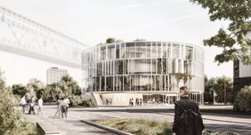 Computergenerierte Visualisierungen simulieren einen Blick auf das neue PRZ1 (eckiges Gebäude) und PRZ2 (zylindrisches Gebäude), die an der Universitätsmedizin Halle entstehen sollen.